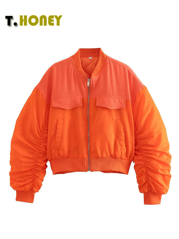 Blouson bomber femme orange flashy sur fond blanc